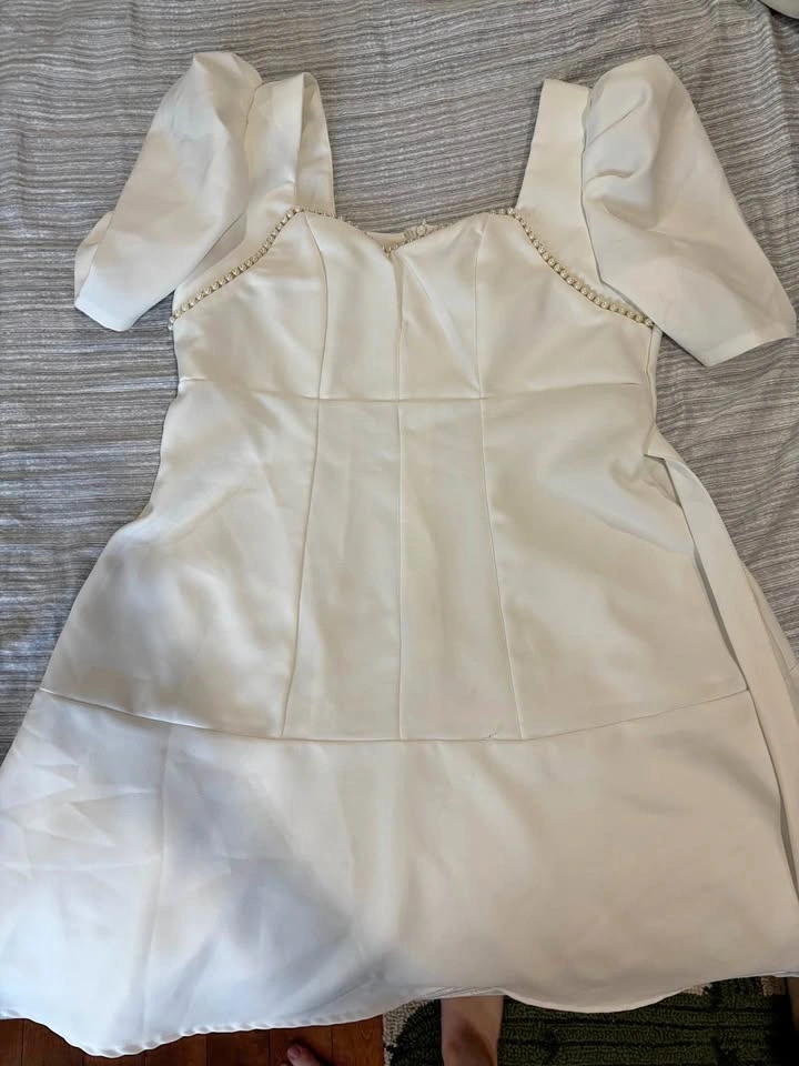 Women’s formal white dress with gold and pearl accents, poofy sl
