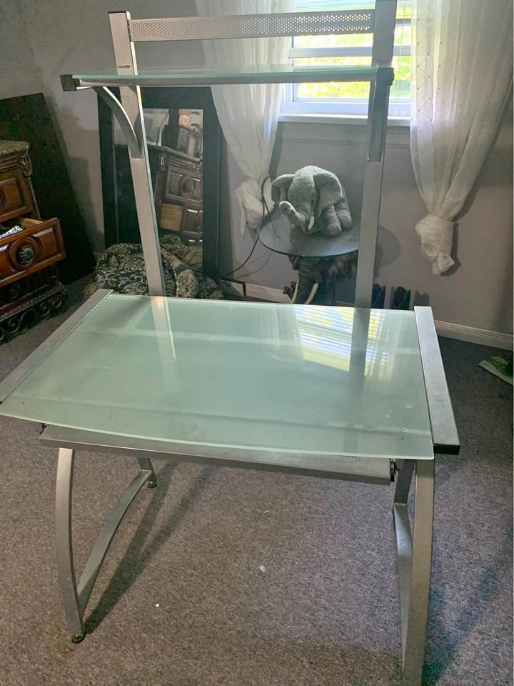 Desk with glass top and shelf
