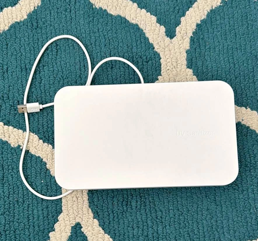 Phone charger with UV sanitizer