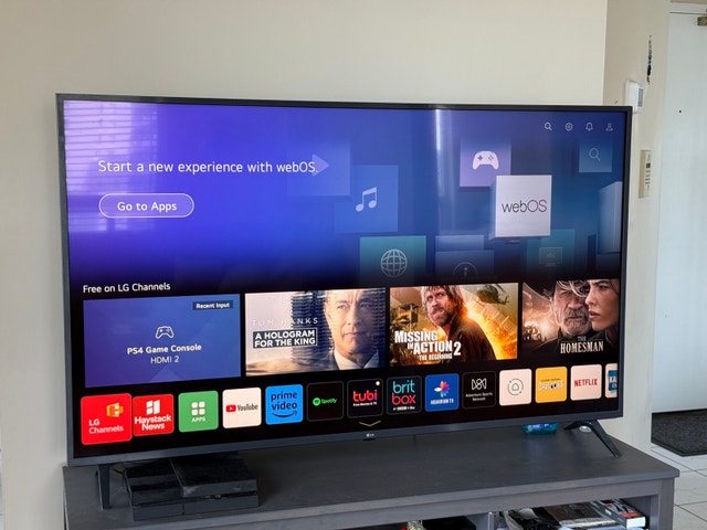 LG 65” LED TV in Good Condition w/free ikea tv stand