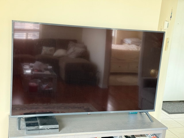 LG 65” LED TV in Good Condition w/free ikea tv stand - photo 2