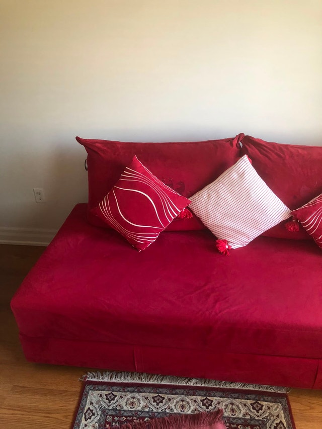 Red Sofa converts to Bed