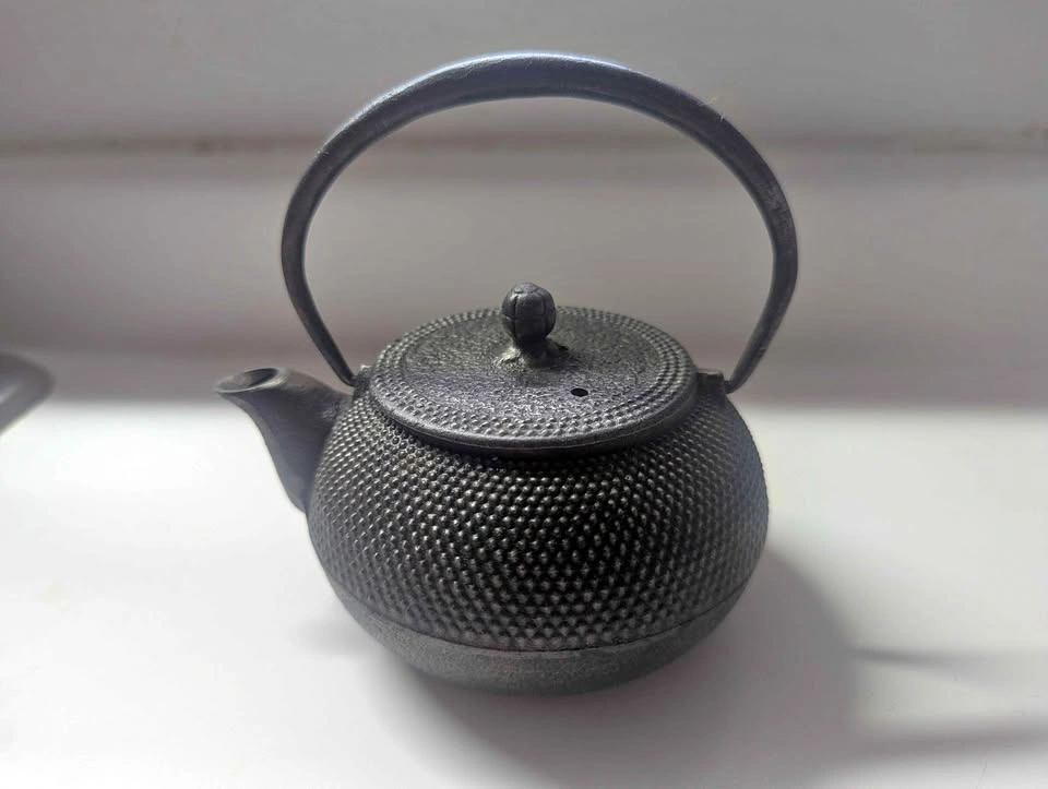 Small cast iron teapot