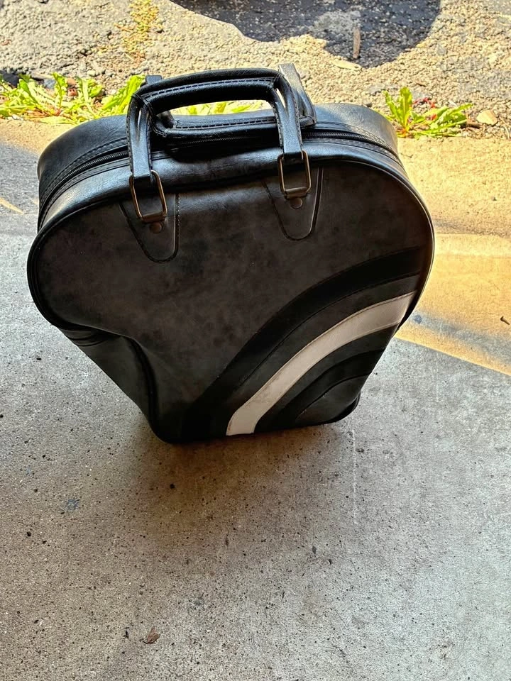 Gray bowling ball with carrying case