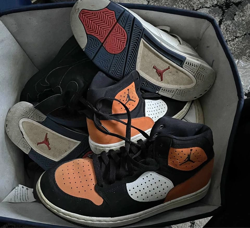 Box full of random shoes