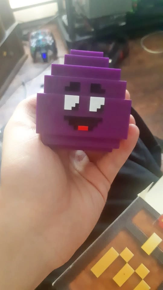 Purple Pixelated Character Figure
