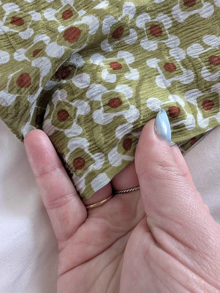 Green patterned silk fabric
