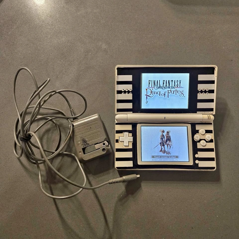 Nintendo DS Lite Console with Charger, Stylus. Working fine.