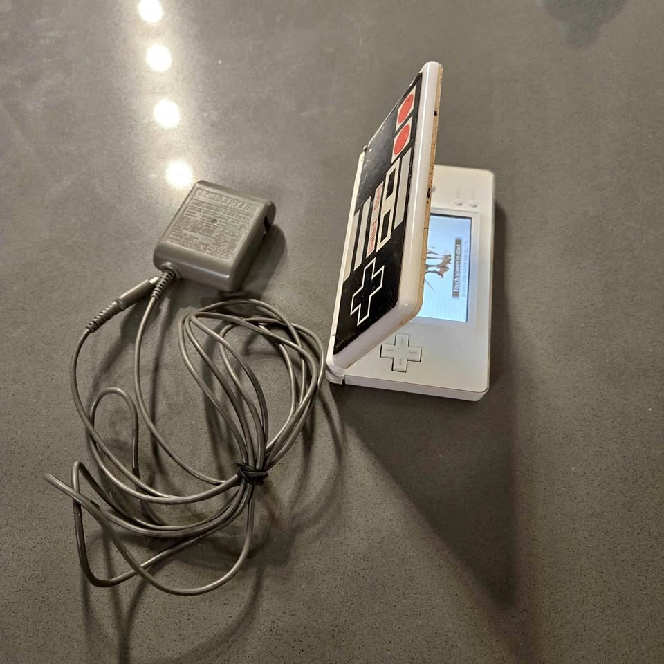 Nintendo DS Lite Console with Charger, Stylus. Working fine.