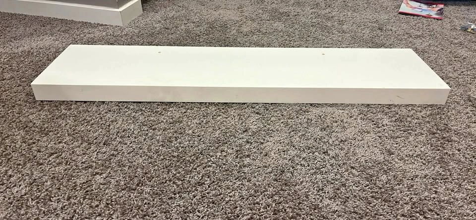 White IKEA floating shelve