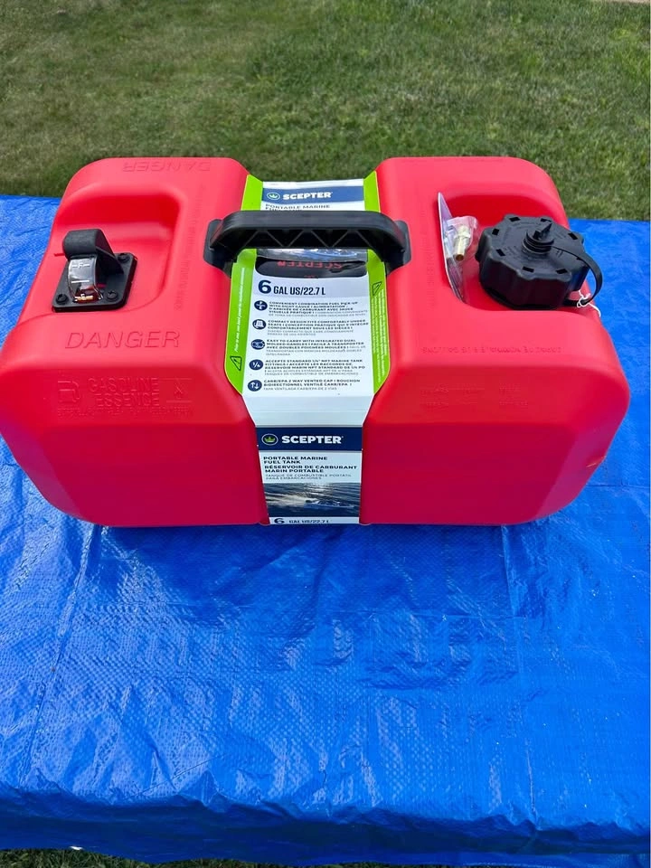 Boat motor gas tank with fitting