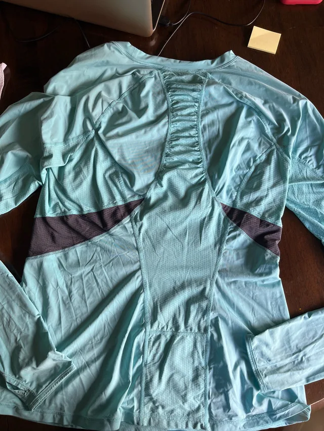 Light teal Lululemon running long sleeve image indicator(2)