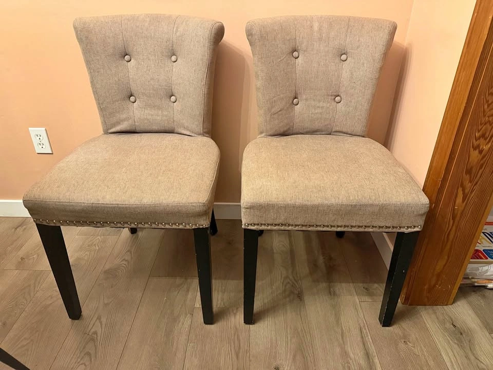Two grey upholstered chairs
