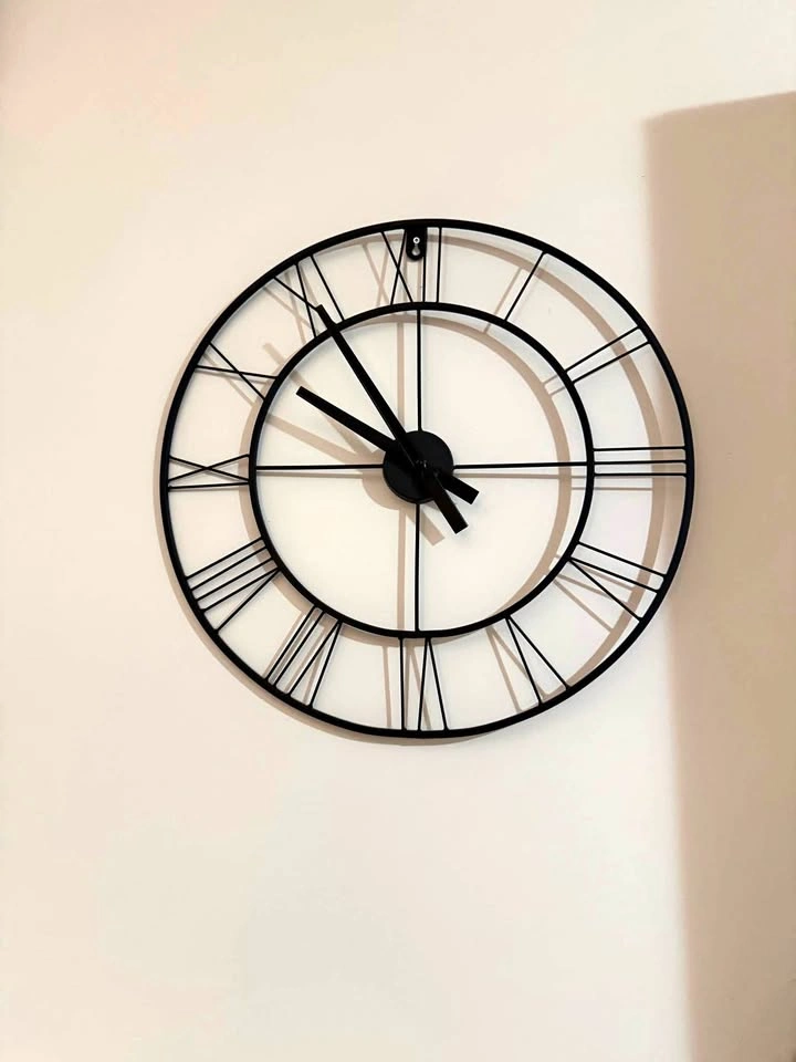 Black Metal Skeleton Wall Clock with Roman Numerals