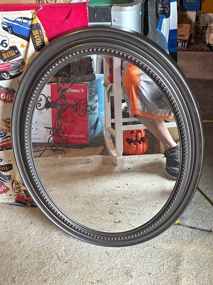 Hanging oval mirror
