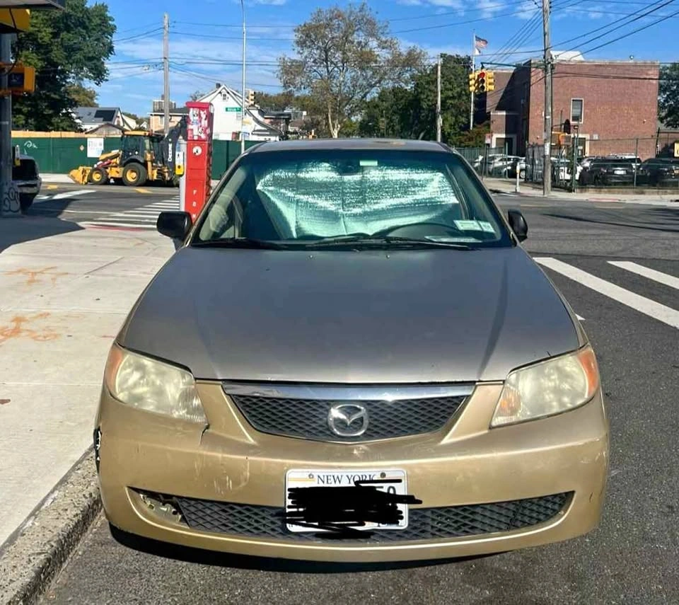 2002 Mazda Protege · Sedan 4D
