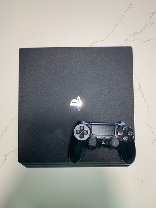 PS4 Pro 1TB Console Bundle w/ 3 Games & Controller