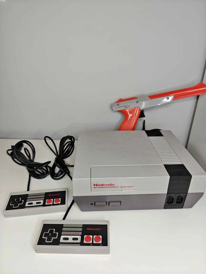 original Nintendo Entertainment System (NES) console with contro