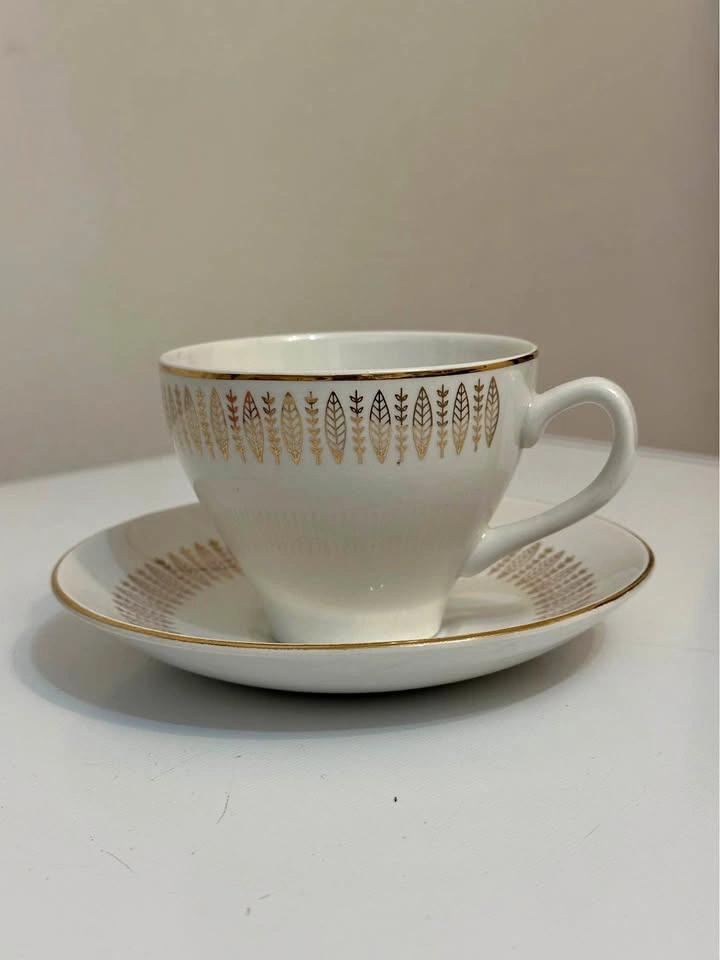 Teacup and saucer gold leaf design