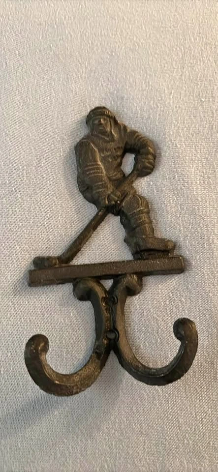 Steel hockey player hook