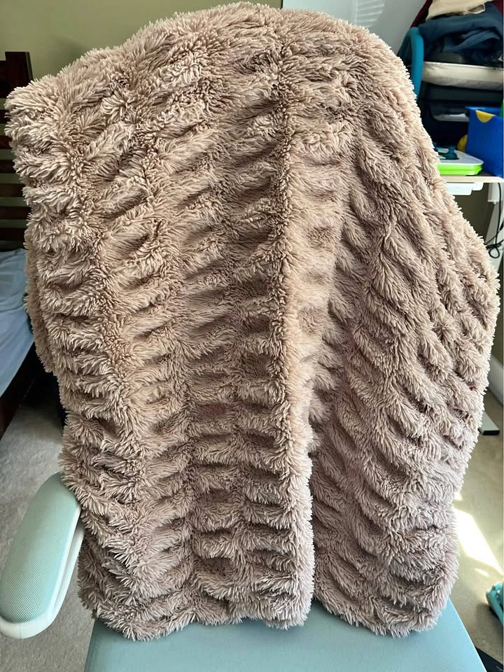 Soft pink Indigo Chapters throw blanket