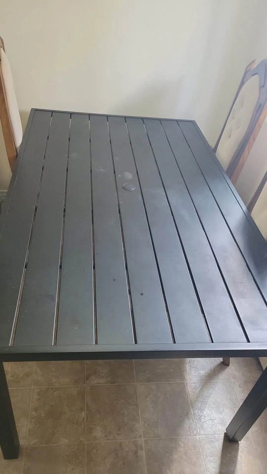 Metal patio table with umbrella hole