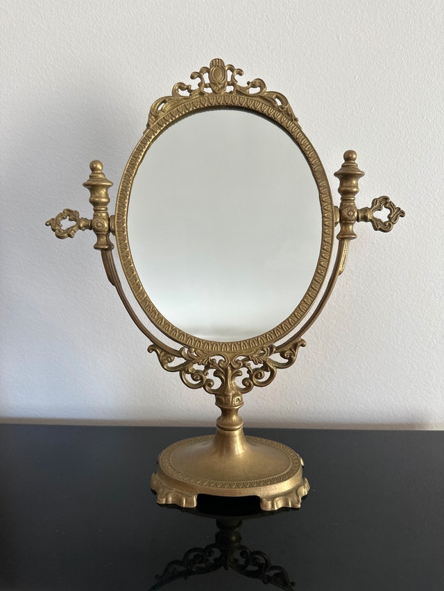 Vintage French-style ornate brass swivel vanity mirror