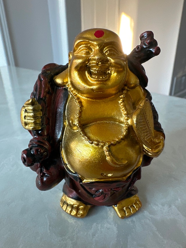 Laughing Buddha statue, also known as Budai or Hotei.