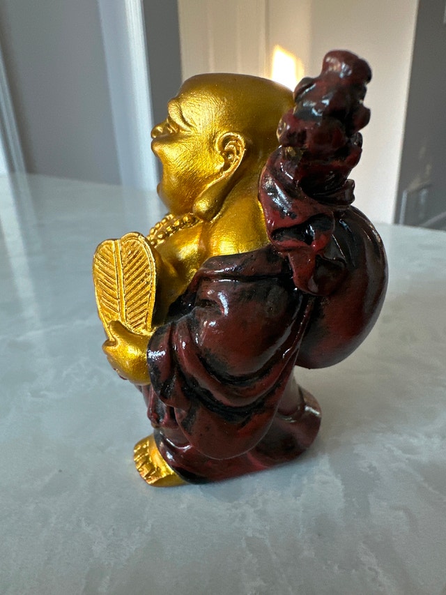 Laughing Buddha statue, also known as Budai or Hotei. - photo 2