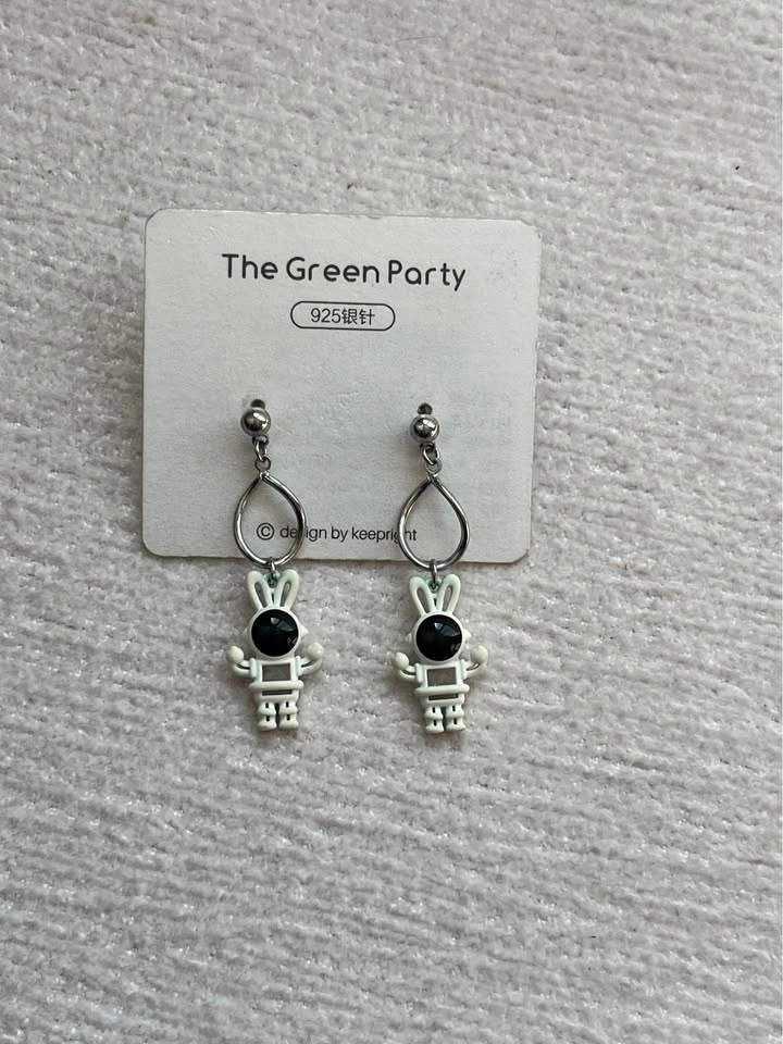 The green party bunny astronaut earrings