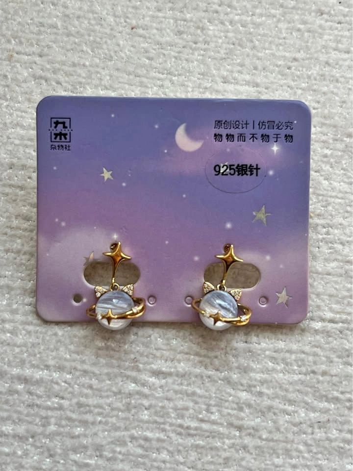 Gold space cat planet earrings
