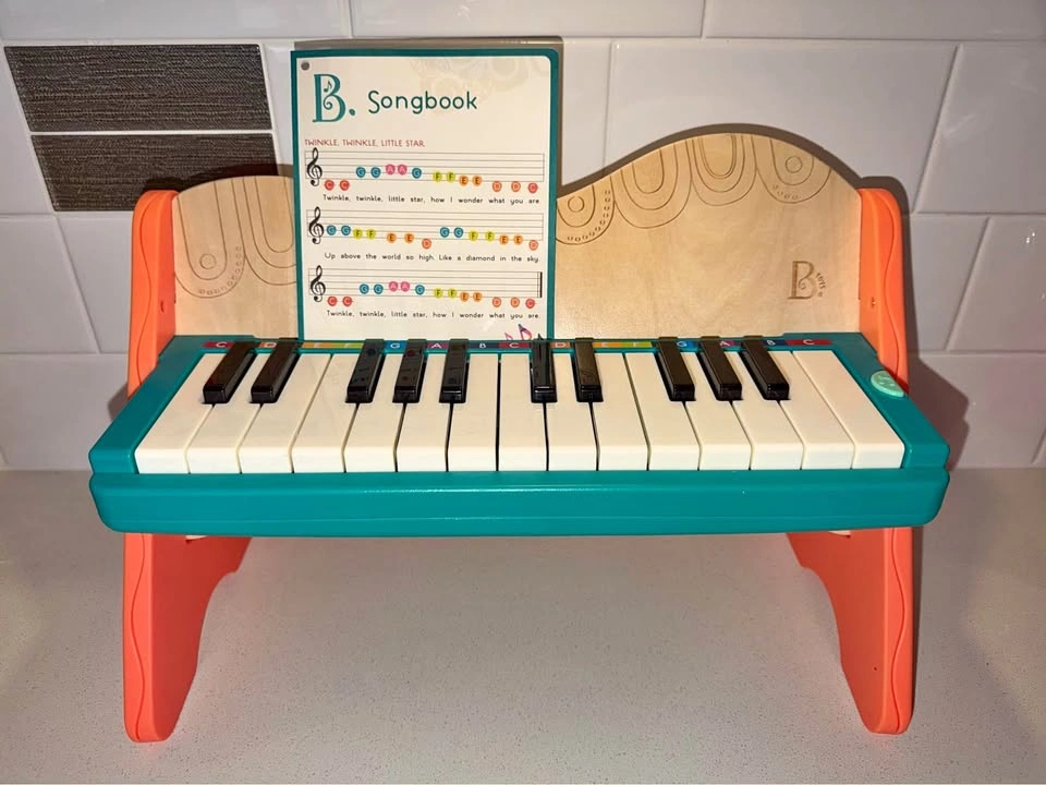 B. toys Mini Wooden Piano