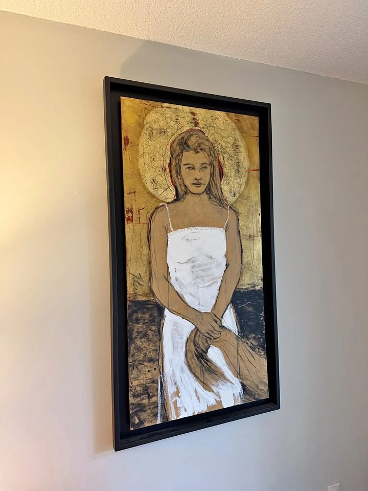 Gold painted wall art, black frame