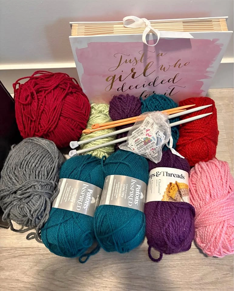 Yarn, needles and stickers for knitting and crochet