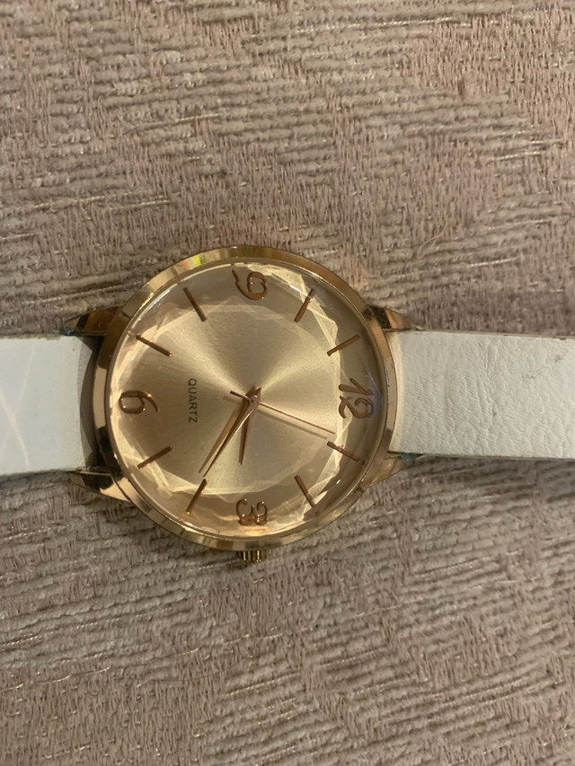 Quartz watch on a white strap