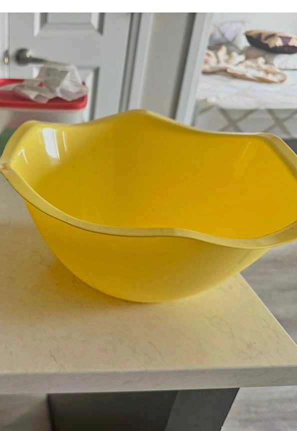 Yellow plastic big mixing bowl