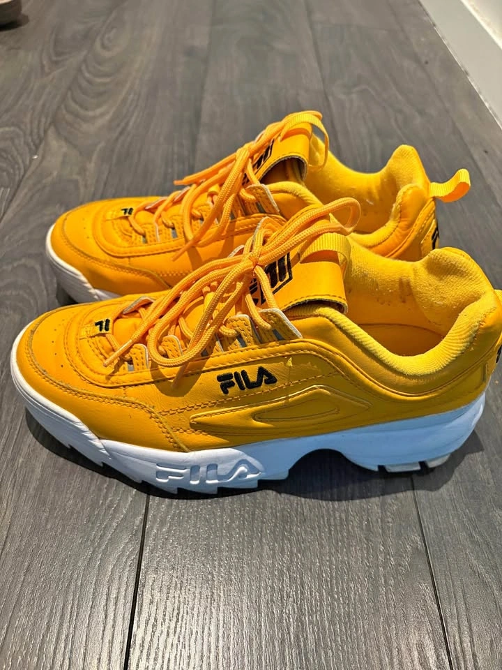 Yellow Fila Disruptors