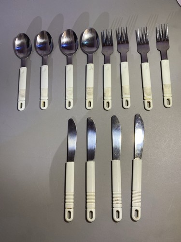Vintage Northland Stainless cutlery set cream plastic handles Ja
