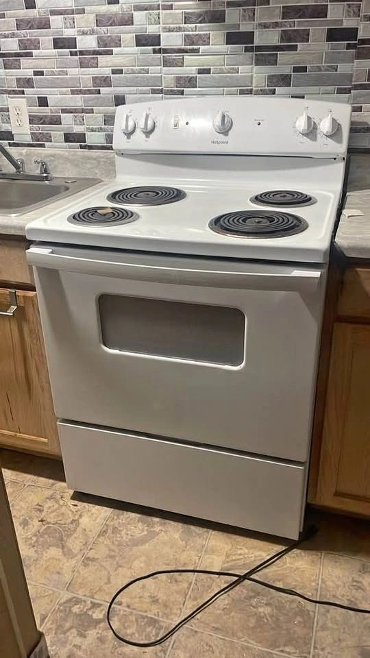 Hotpoint Electric Stove, Refrigerator, and Microwave Set