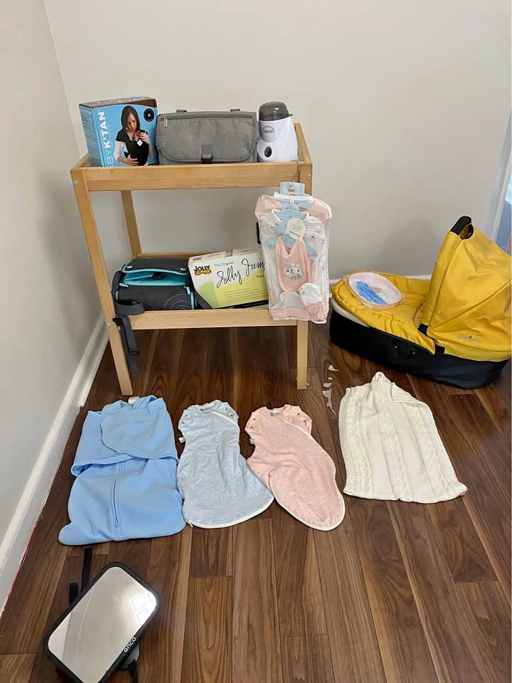 Baby changing table, swaddle, carrier and more