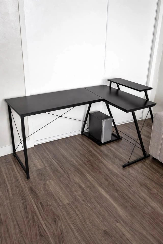 Brand new in box. L shaped desk with elevated shelf