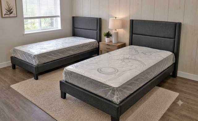 Two Grey Upholstered Twin Bed Frames with Mattresses