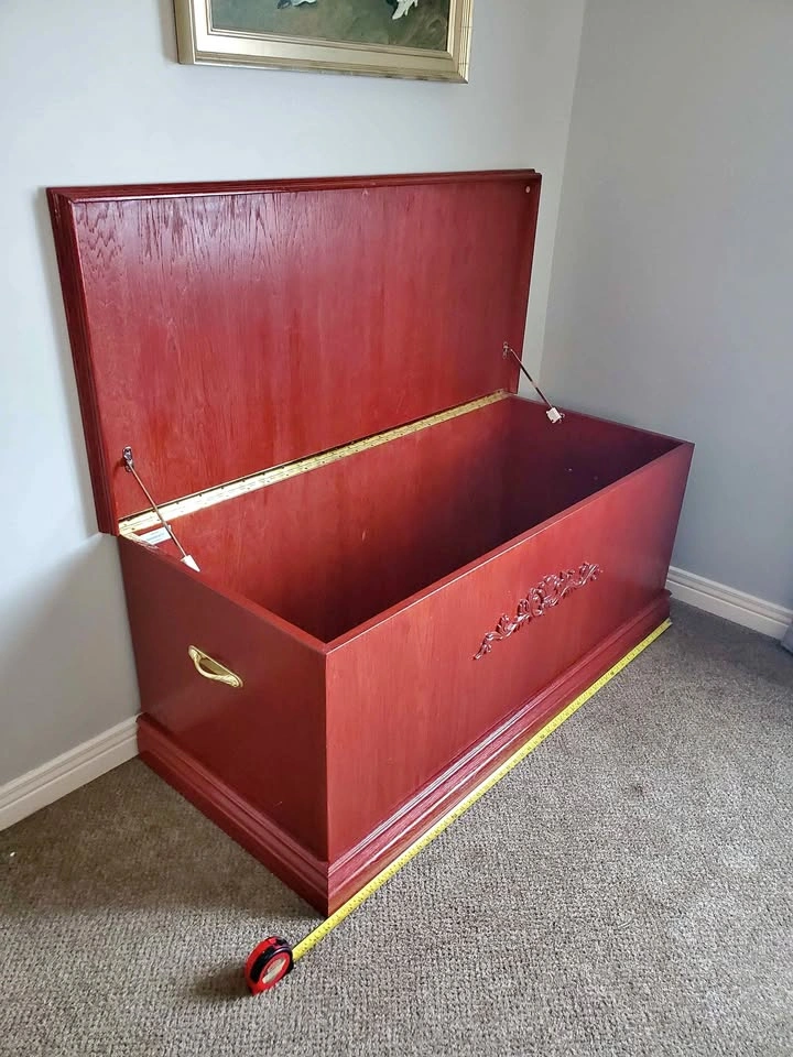 Red Wooden Storage Chest with Decorative Carving