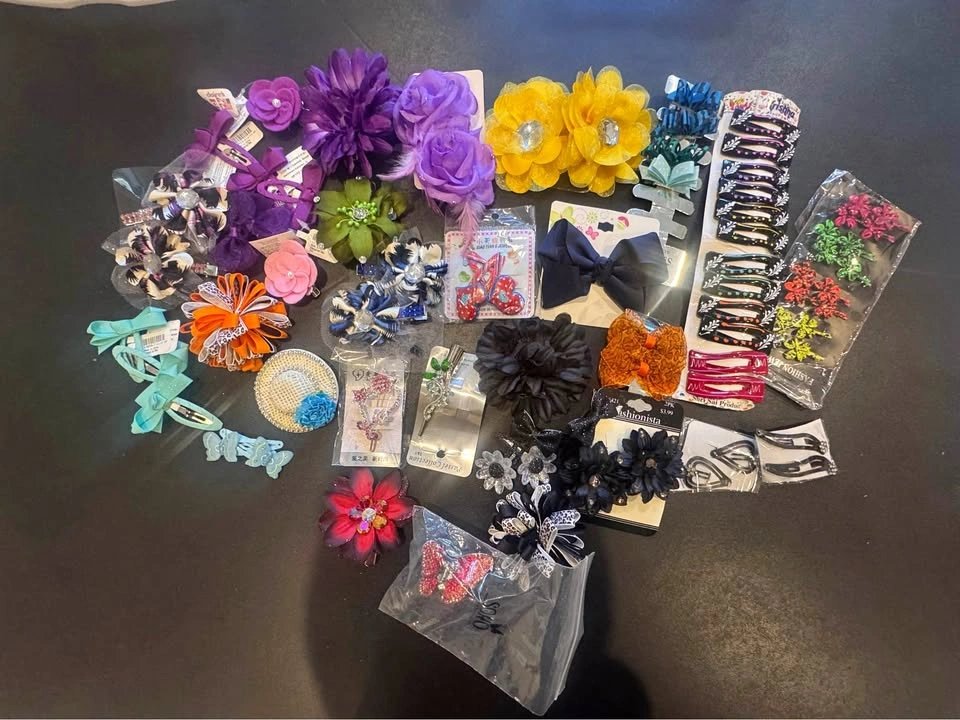 Over 30 pairs of floral hair clips