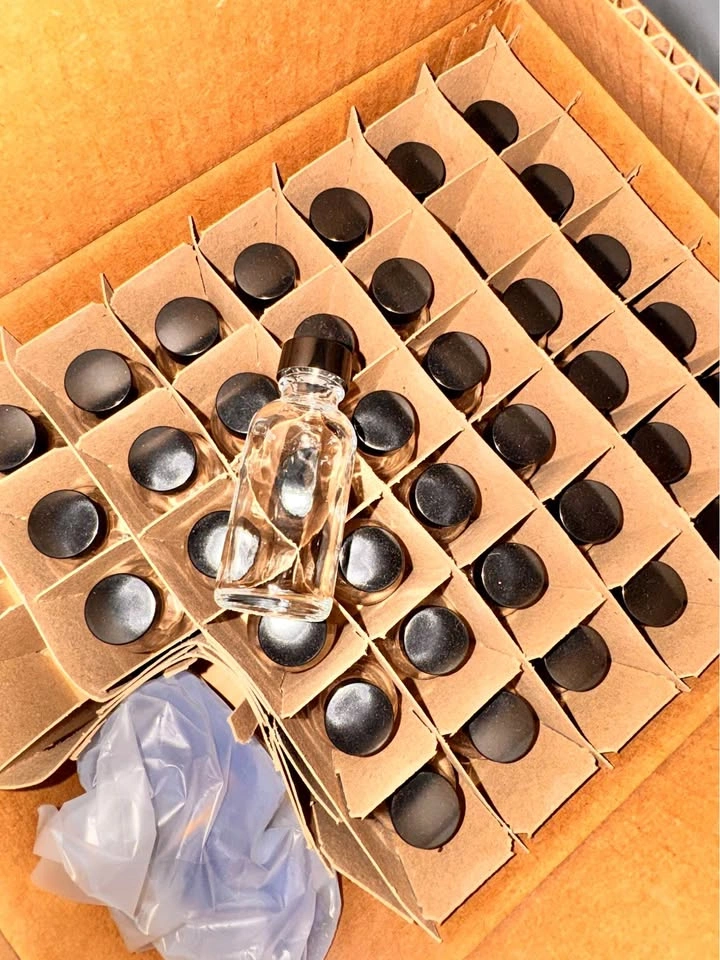 1oz Sample Bottles. Glass Bottles with Black Caps - 39 in total.