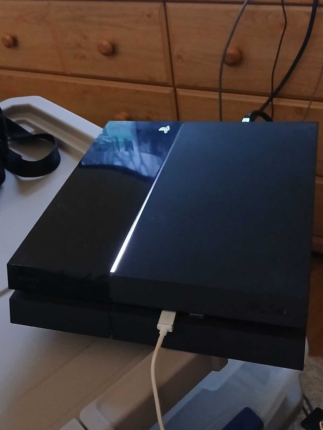 PS4 with P.T. Demo & 36 Digital Games + Two Controllers