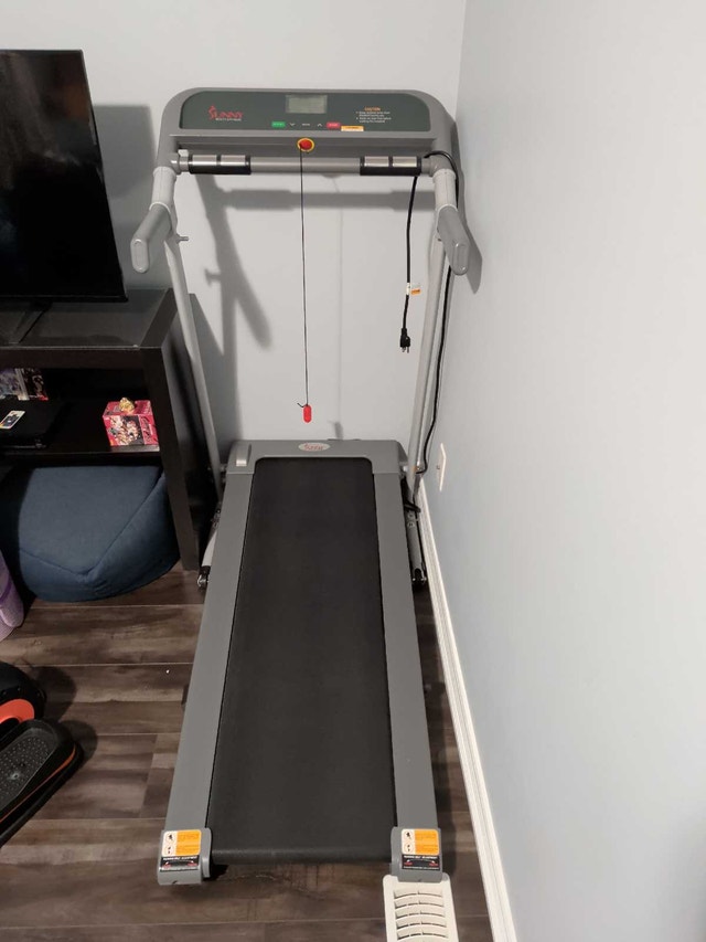Compact motorized treadmill with heart rate monitoring - photo 3