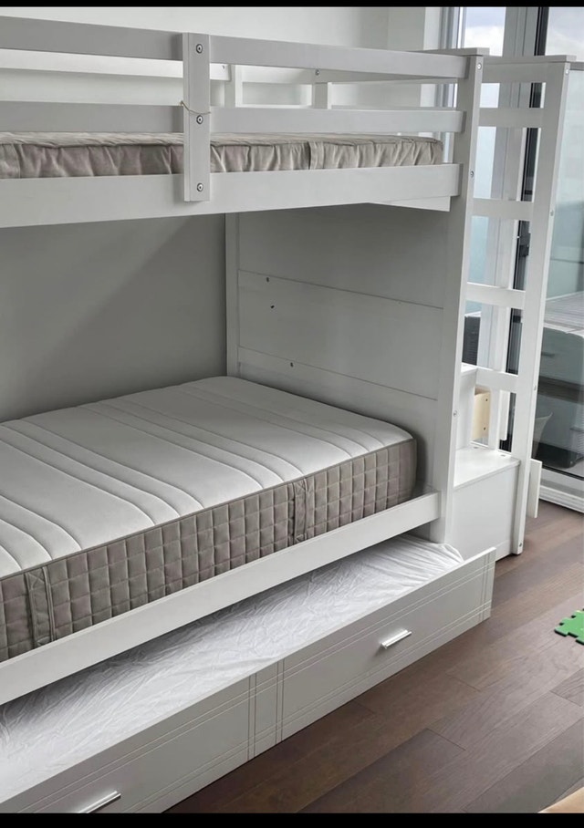 Twin over twin bunk bed with an extra bed