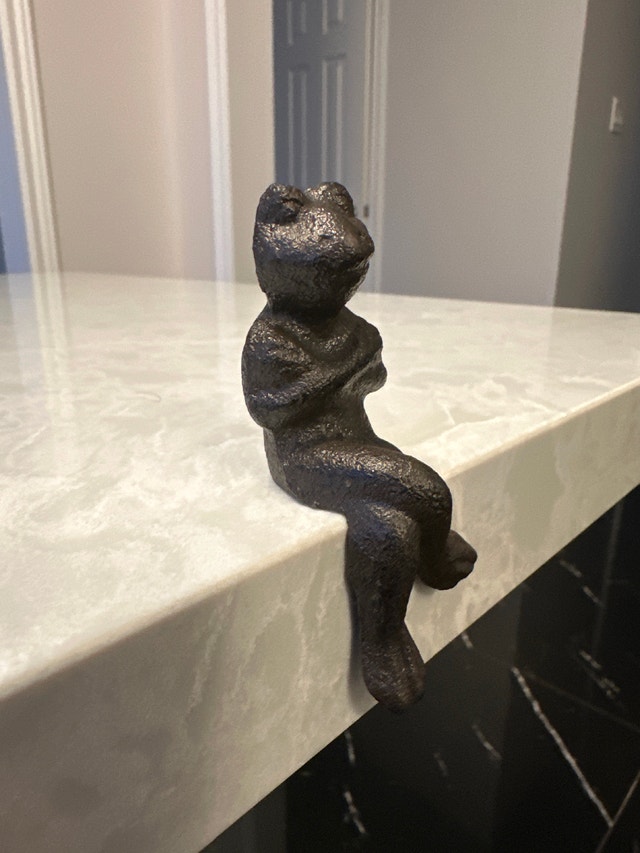 Small cast iron frog figurine