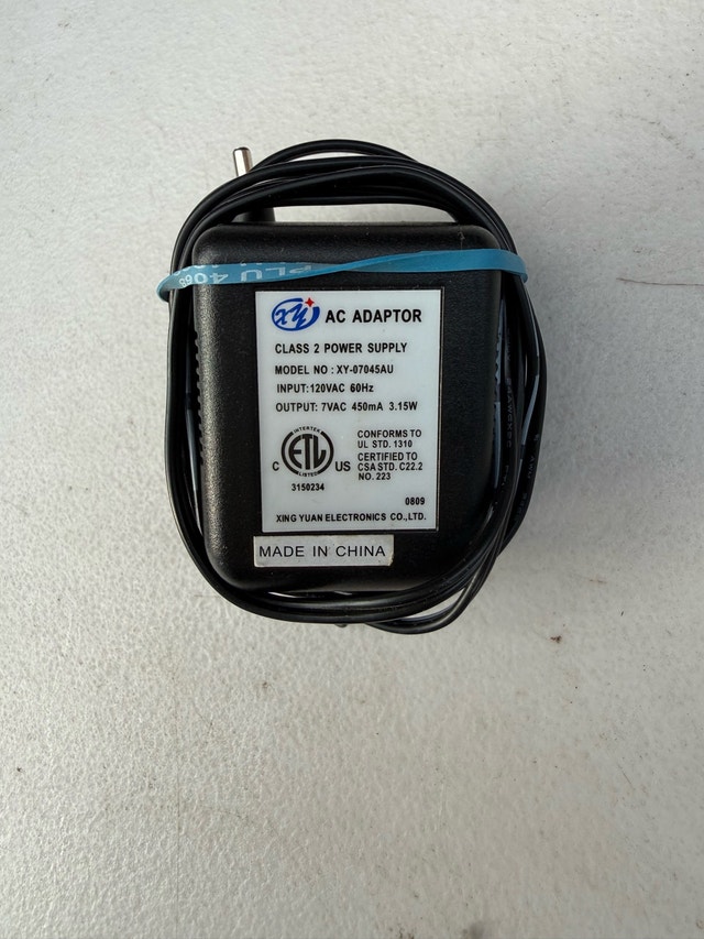 Xing Yuan Electronics AC Adaptor 7V 0.45A - photo 2